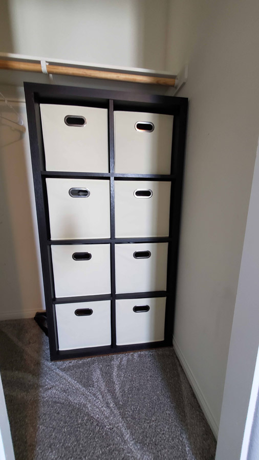 Shelf with bins in closet